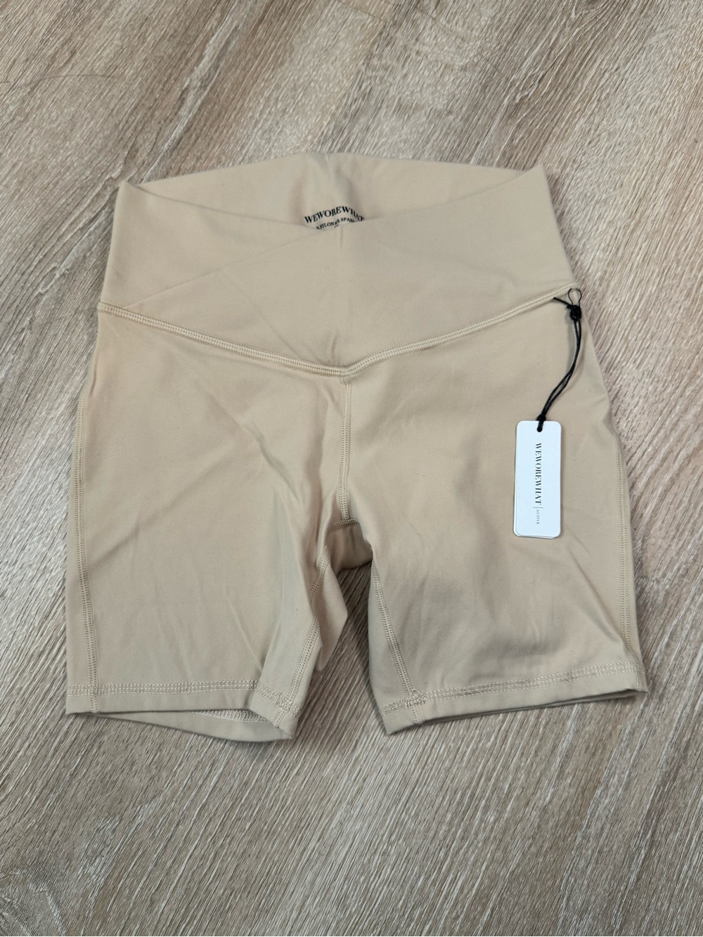 WeWoreWhat high waisted cross over biker shorts in Beige